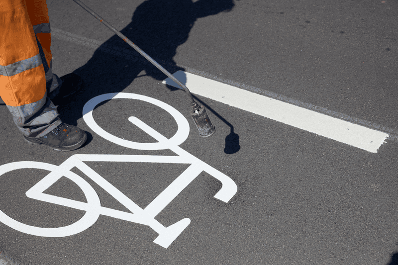 Applying EasyTherm cold-applied plastic stencil markings to the road