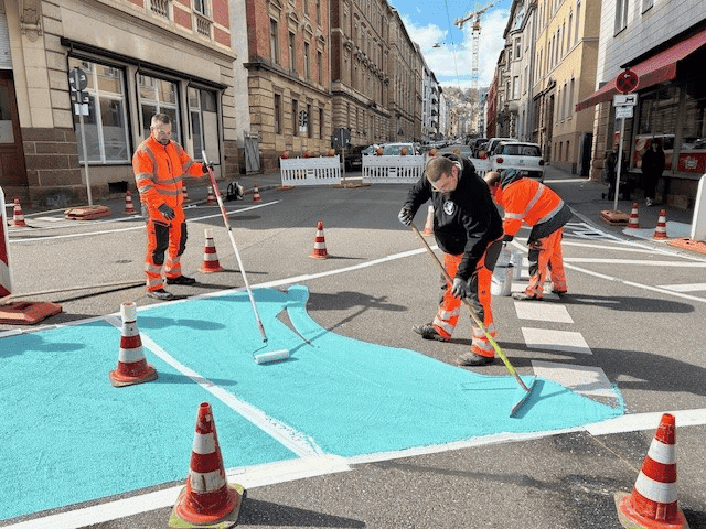 Colored traffic area with applied markings in an urban street environment